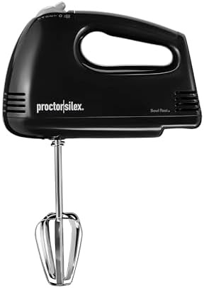 Five speed electric mixer with bowl rest